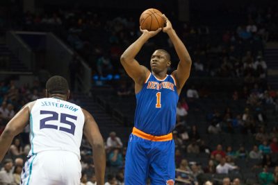Oct 17, 2015; Charlotte, NC, USA; New York Knicks forward Kevin Seraphin (1) shoots the ball over Charlotte Hornets center Al Jefferson (25) during the first half at Time Warner Cable Arena. Mandatory Credit: Jeremy Brevard-USA TODAY Sports